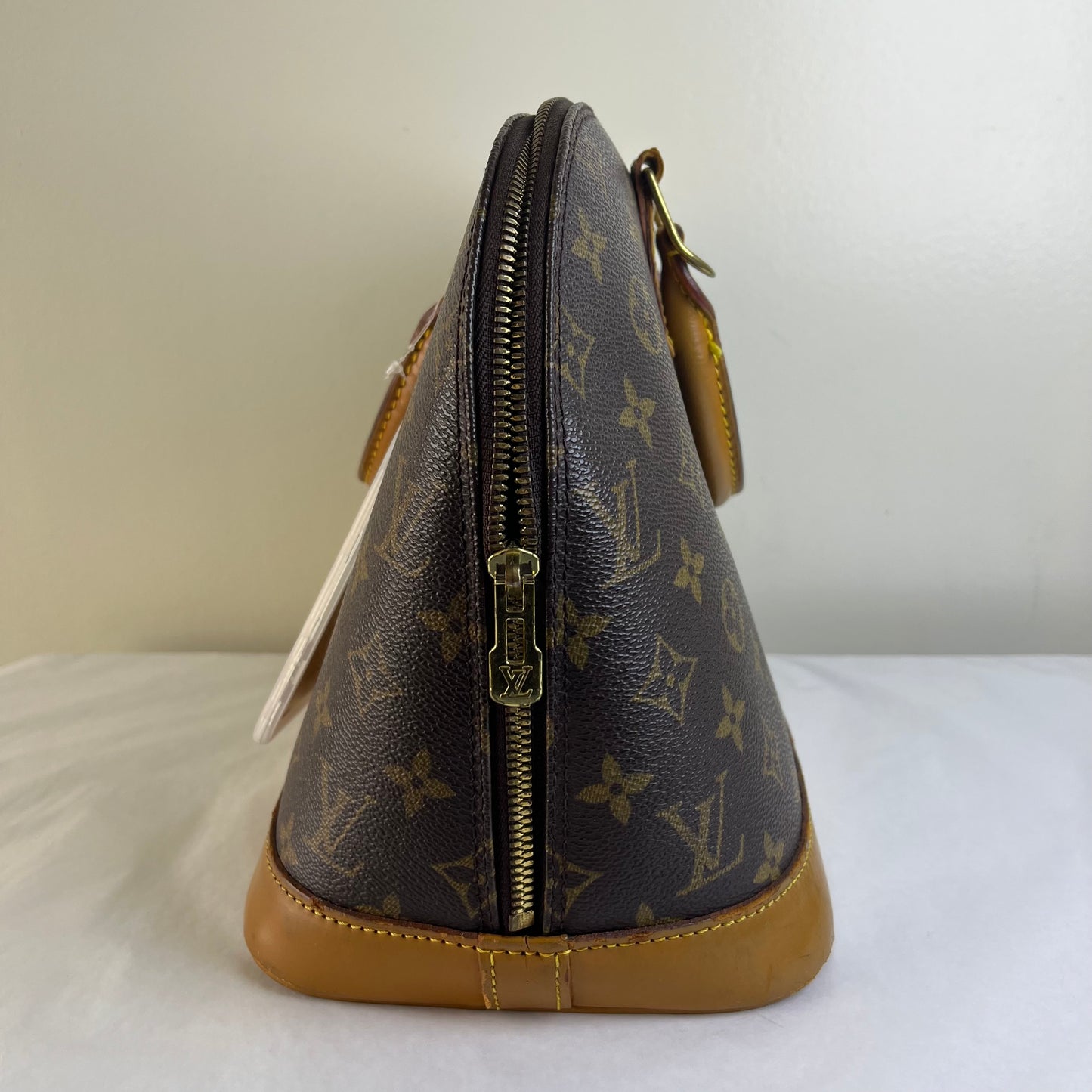 Louis Vuitton Alma PM Monogram Canvas – 9.4"H x 12.6"L x 6.3"W