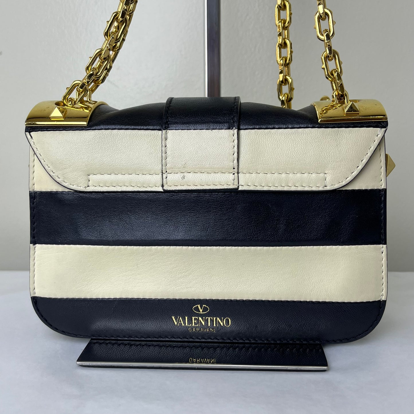 Valentino Nappa Striped Rockstud Black-White – 6.3"H x 9.8"L x 2.8"W