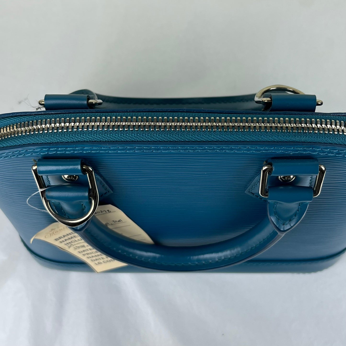 Louis Vuitton Alma BB Epi Teal β 6.7"H x 9.8"L x 4.7"W