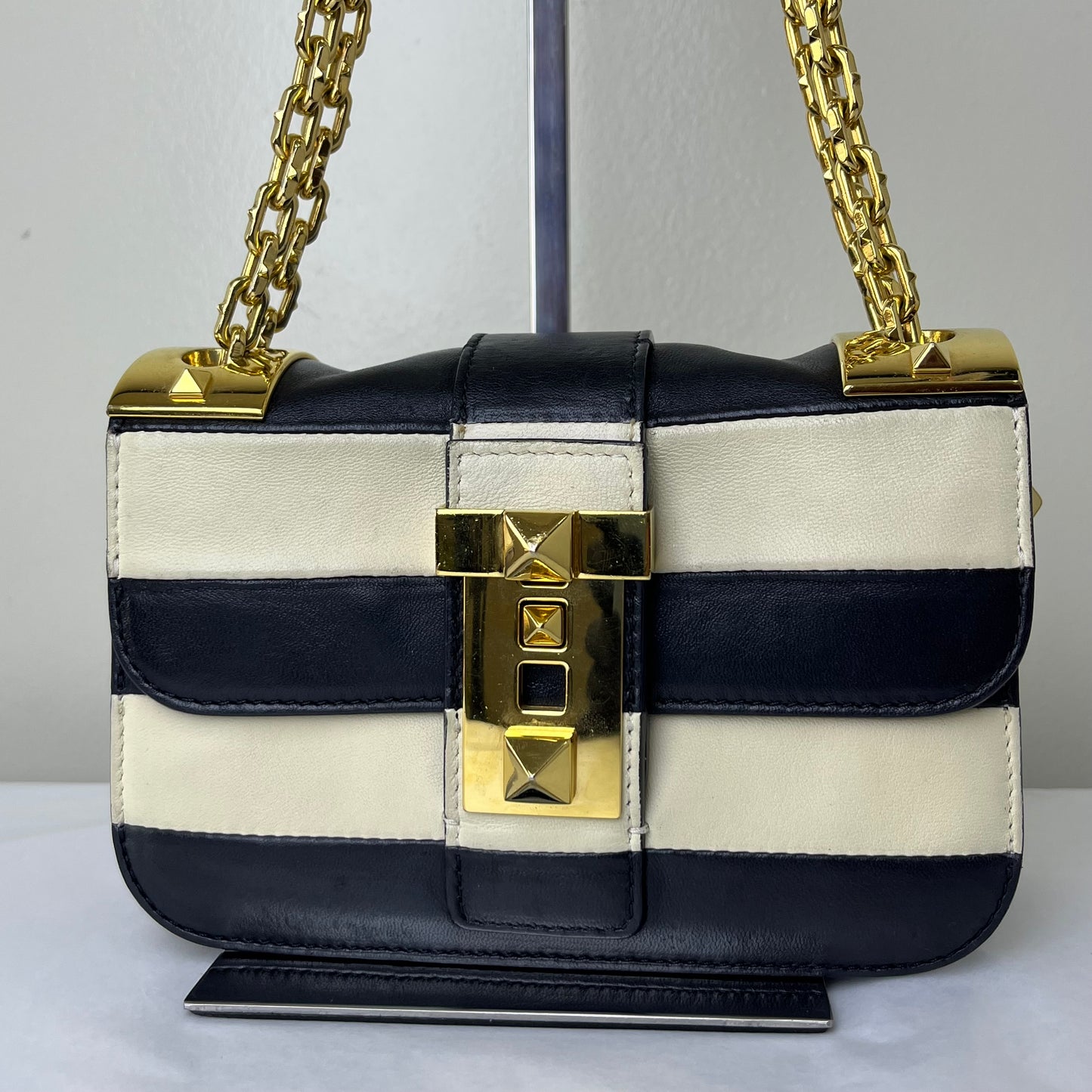 Valentino Nappa Striped Rockstud Black-White – 6.3"H x 9.8"L x 2.8"W