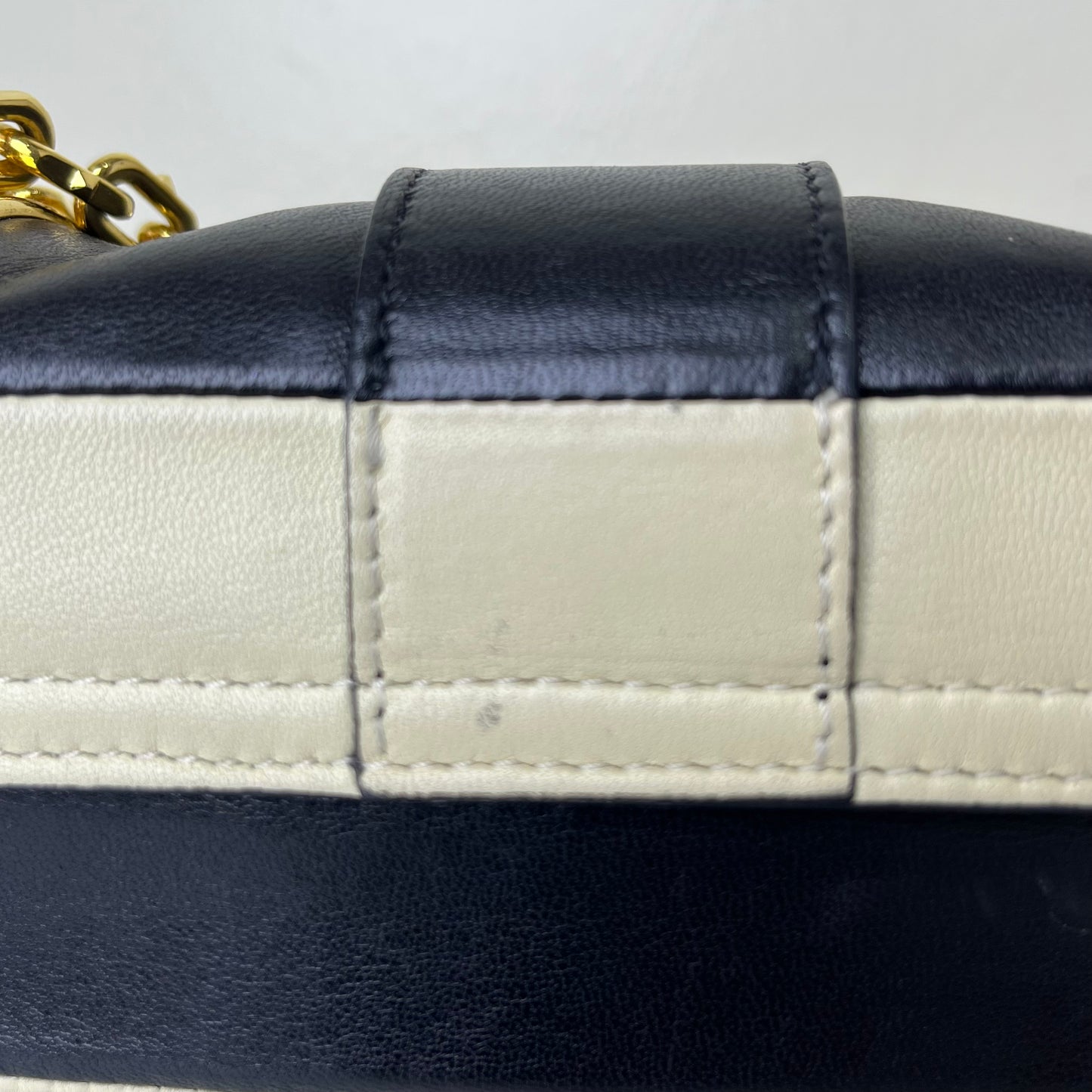 Valentino Nappa Striped Rockstud Black-White – 6.3"H x 9.8"L x 2.8"W