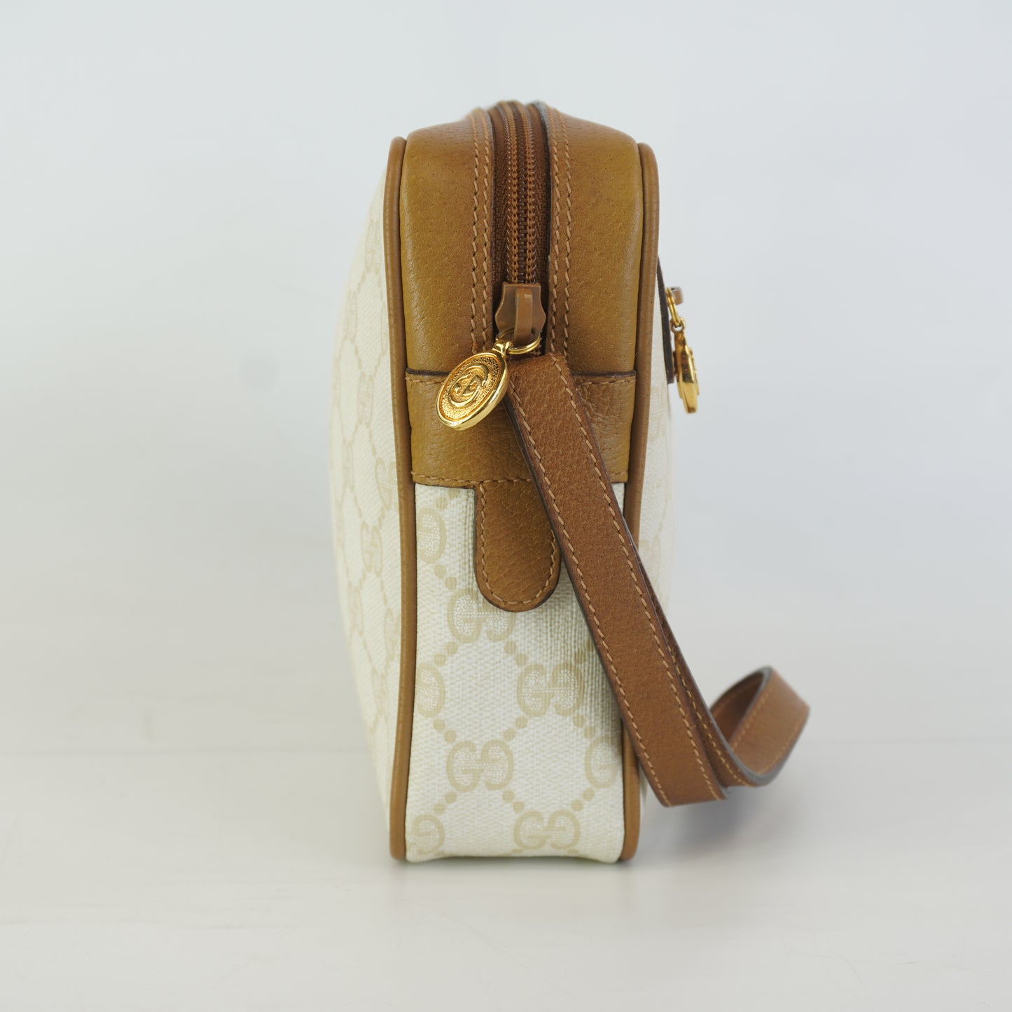 Gucci  GG Mono Coated Canvas Clutch