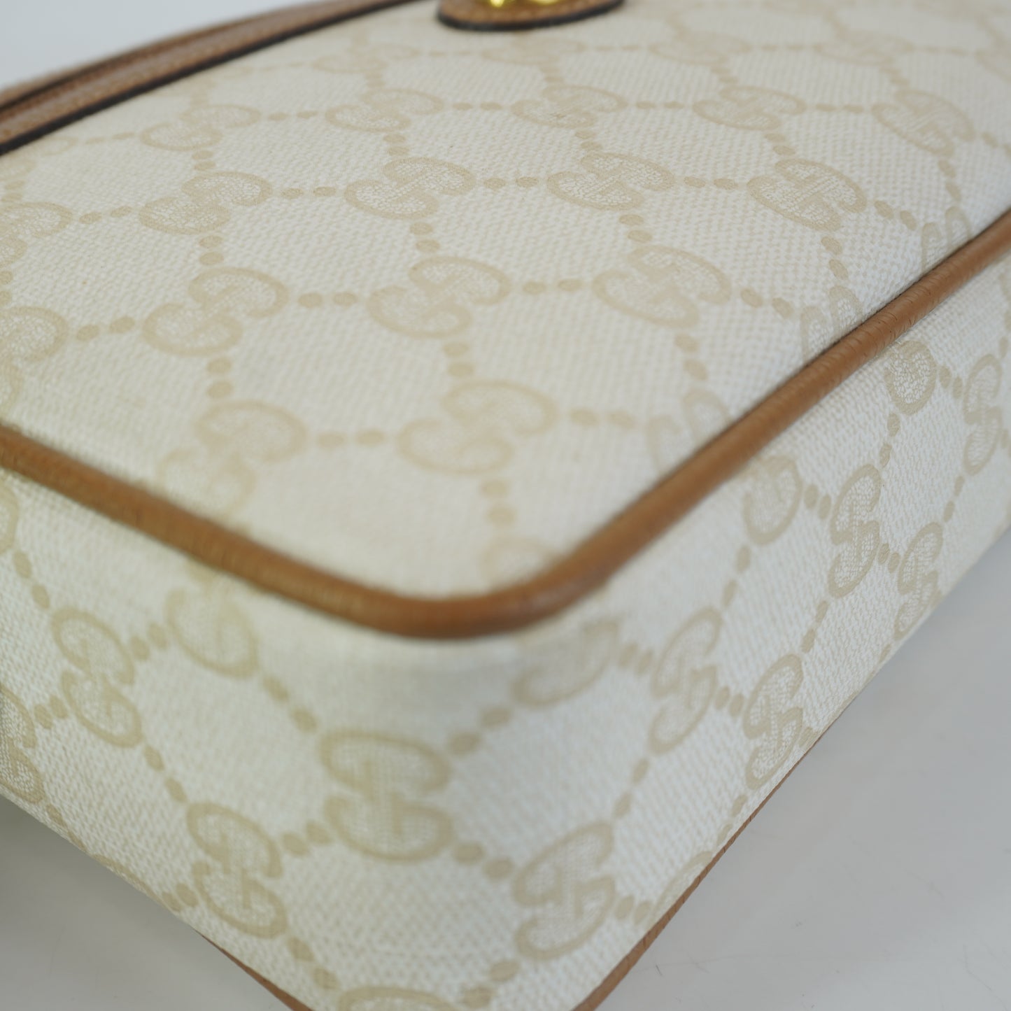 Gucci  GG Mono Coated Canvas Clutch
