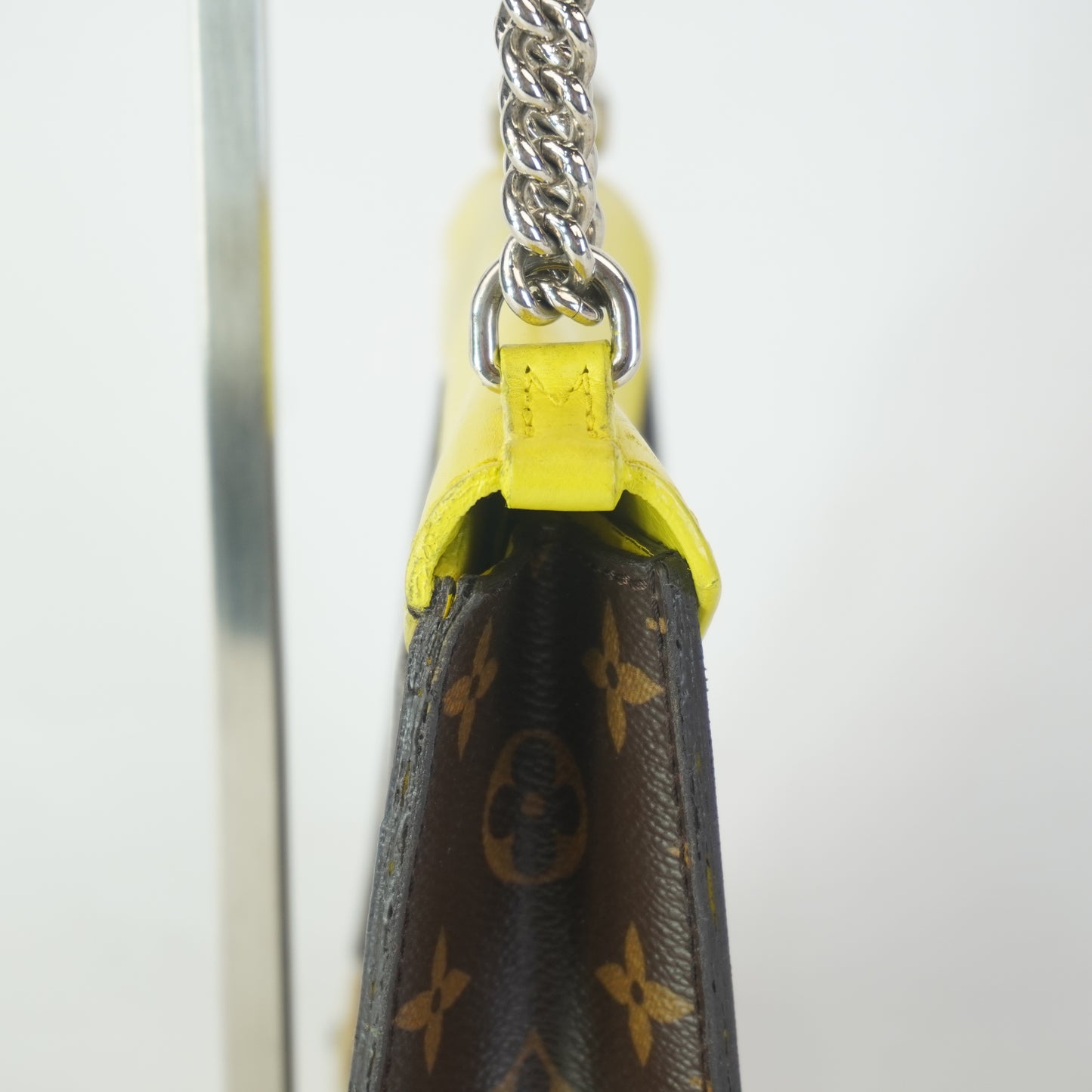 Louis Vuitton	Tribal Mask Pochette Monogram Yellow Trims