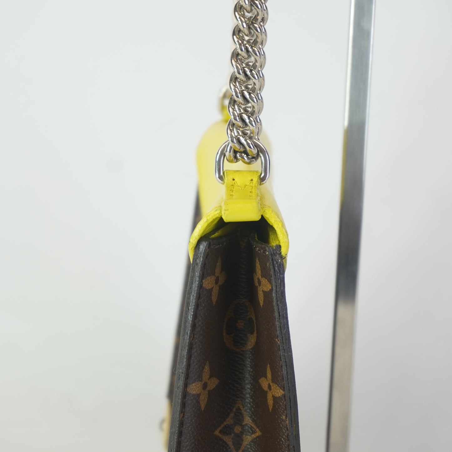 Louis Vuitton	Tribal Mask Pochette Monogram Yellow Trims