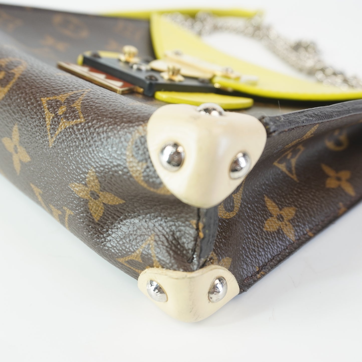 Louis Vuitton	Tribal Mask Pochette Monogram Yellow Trims