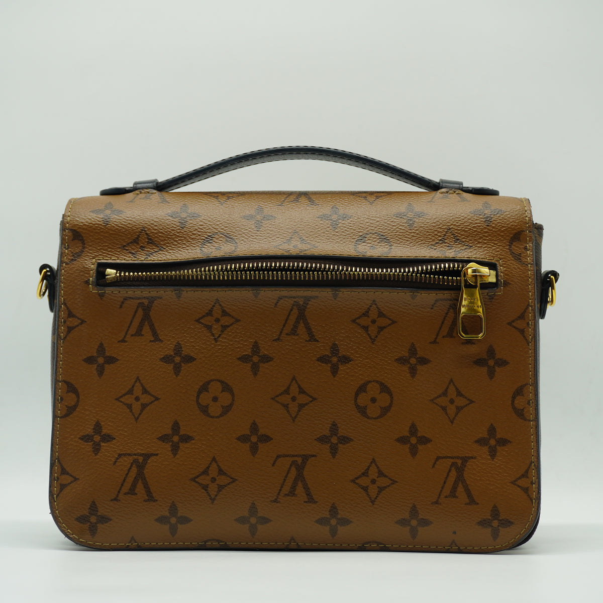 Louis Vuitton	Pochette Métis Small Monogram Reverse Canvas GHW