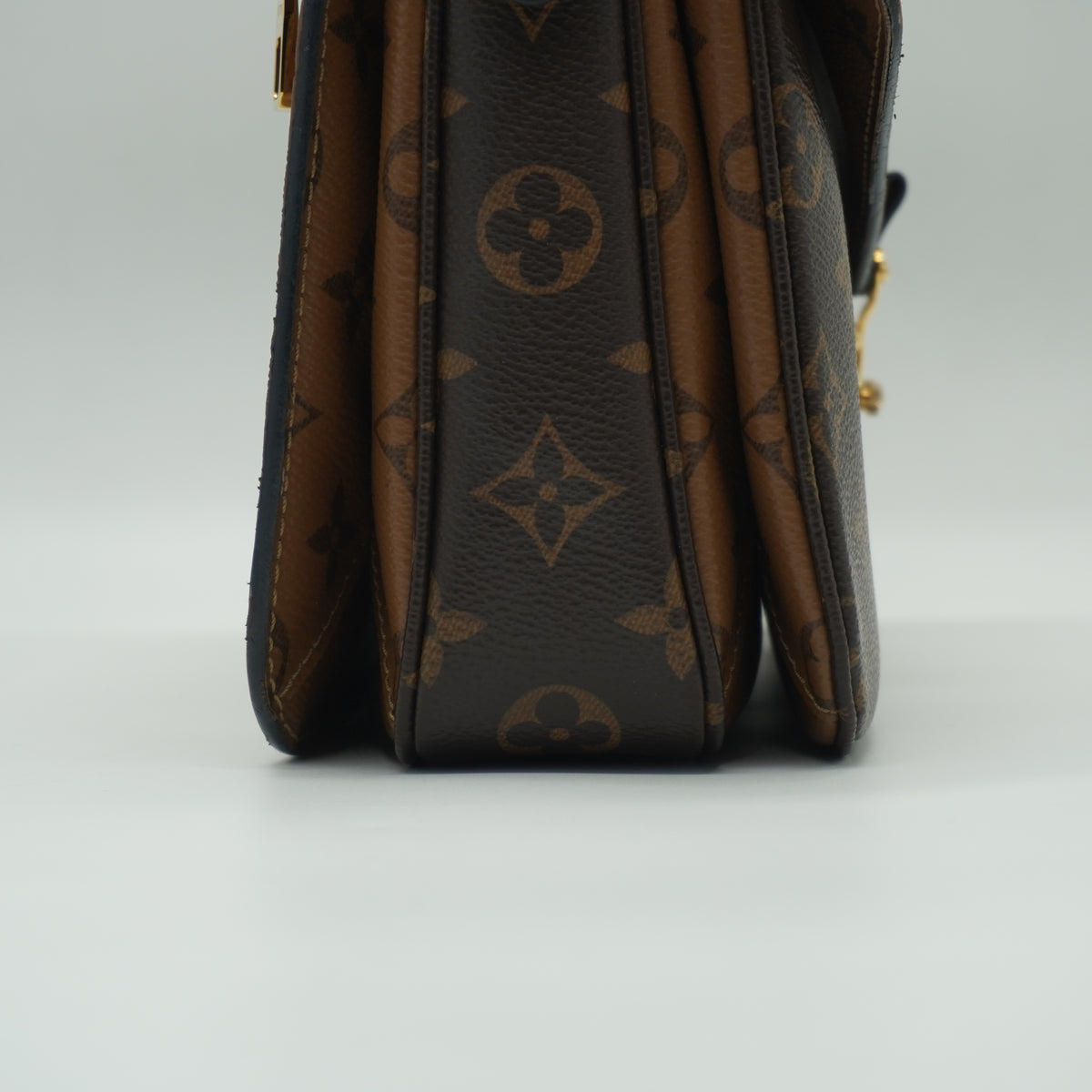 Louis Vuitton	Pochette Métis Small Monogram Reverse Canvas GHW
