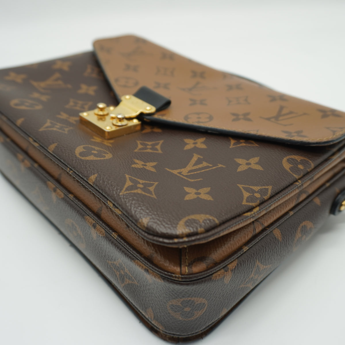 Louis Vuitton	Pochette Métis Small Monogram Reverse Canvas GHW
