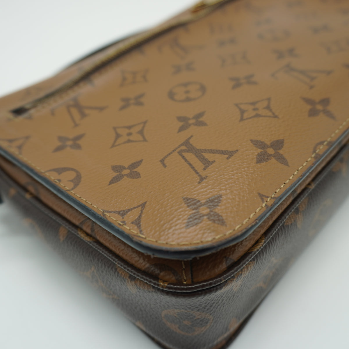 Louis Vuitton	Pochette Métis Small Monogram Reverse Canvas GHW