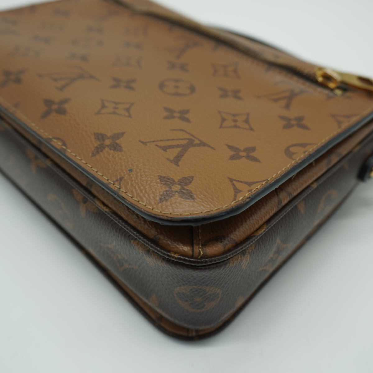 Louis Vuitton	Pochette Métis Small Monogram Reverse Canvas GHW