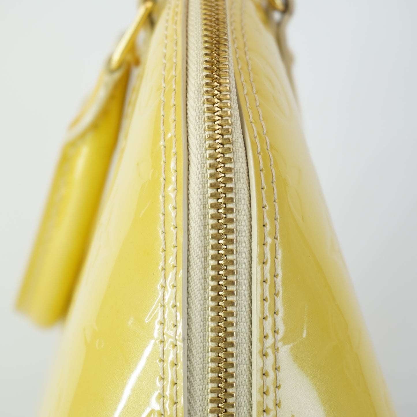 Louis Vuitton	Alma PM Yellow Mono Vernis Patent