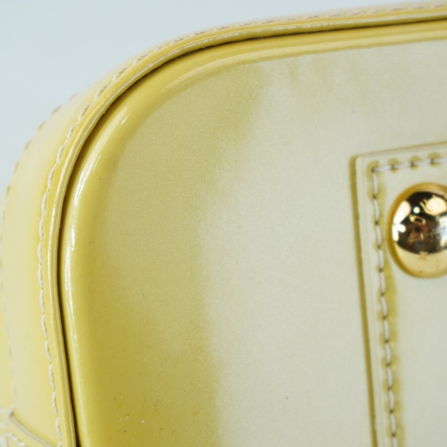 Louis Vuitton	Alma PM Yellow Mono Vernis Patent