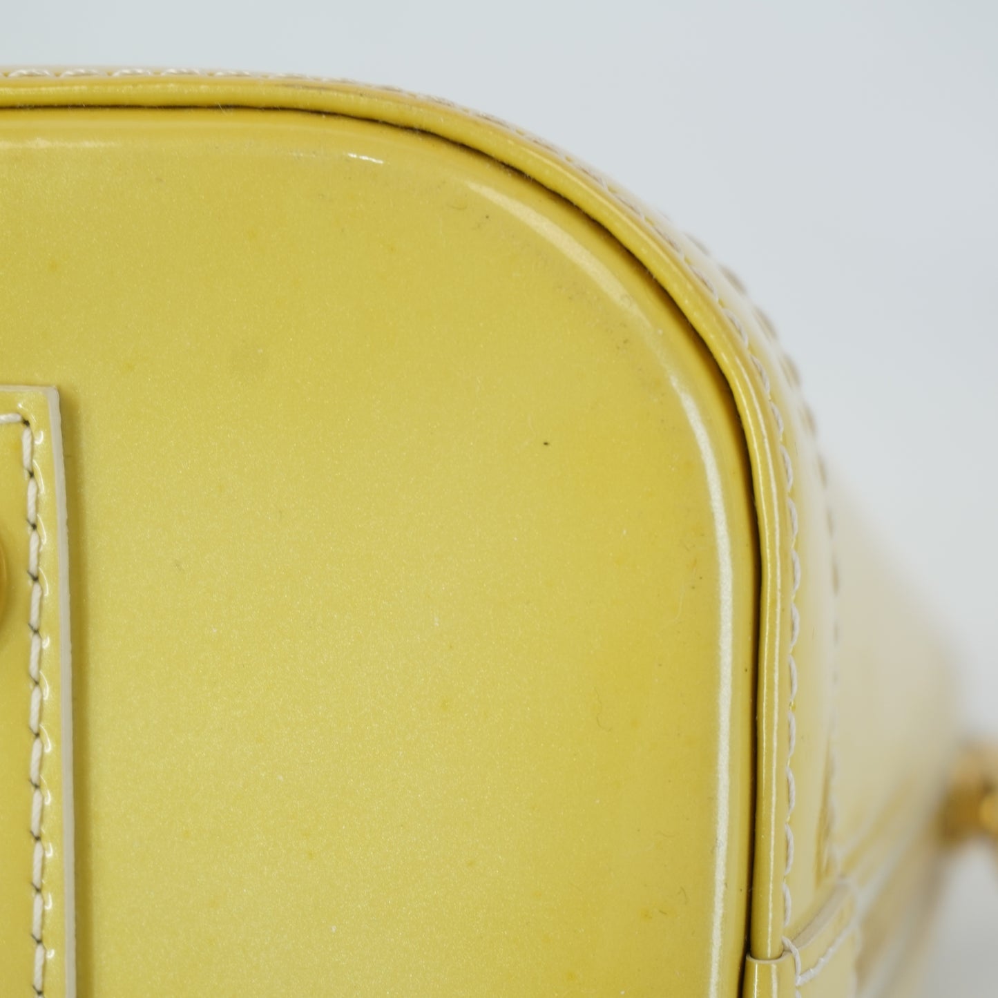Louis Vuitton	Alma PM Yellow Mono Vernis Patent