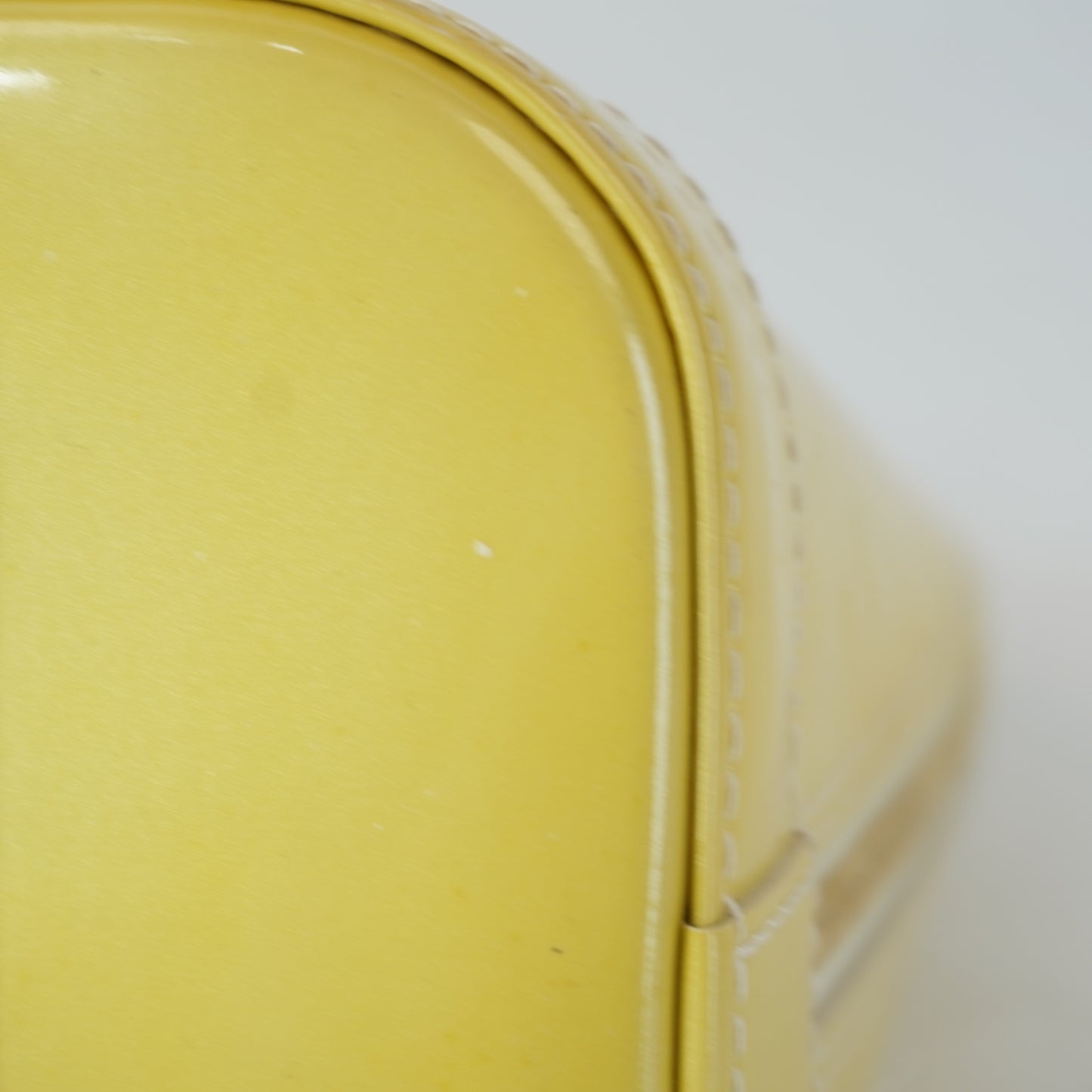 Louis Vuitton	Alma PM Yellow Mono Vernis Patent
