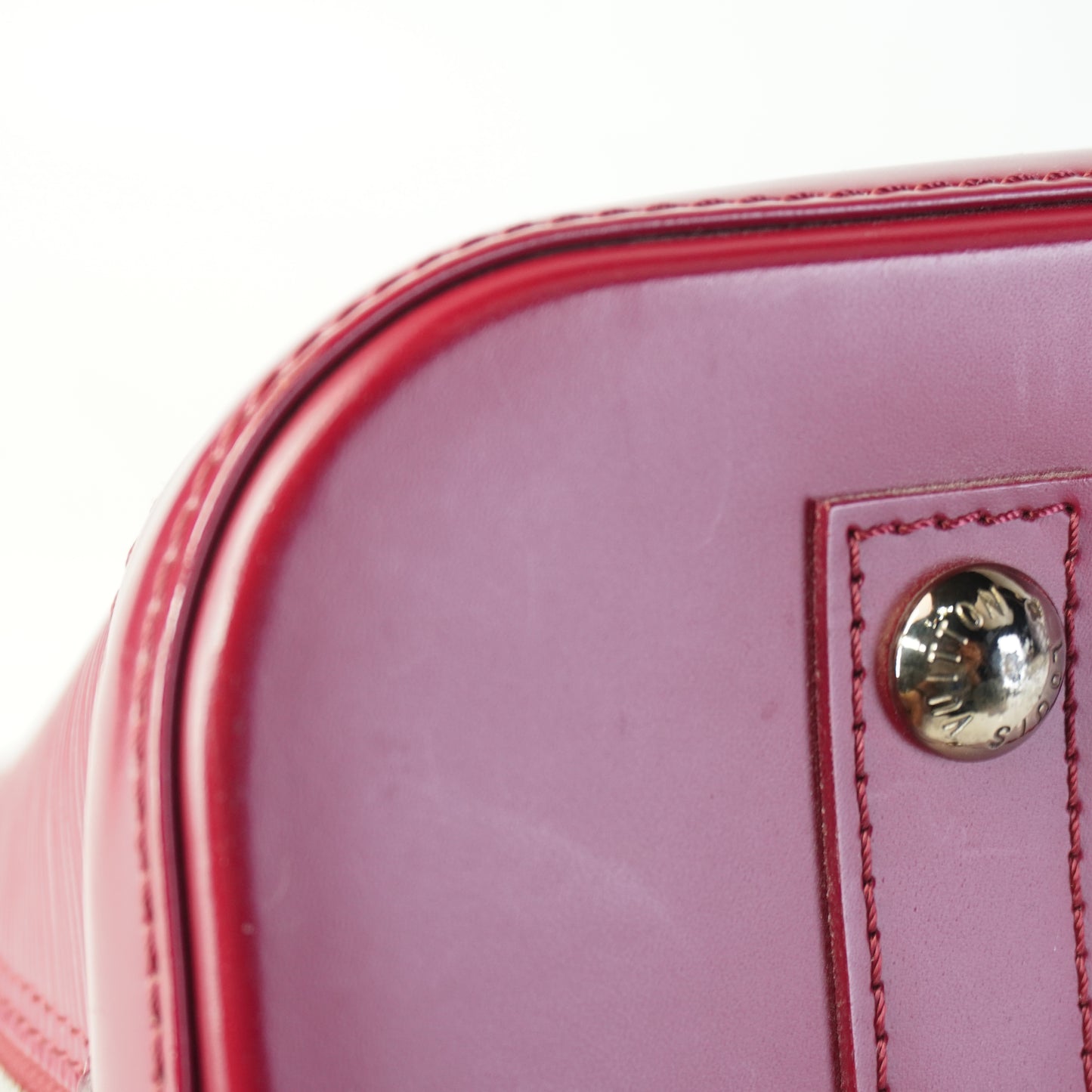 Louis Vuitton	Alma Handbag Epi Leather Burgundy