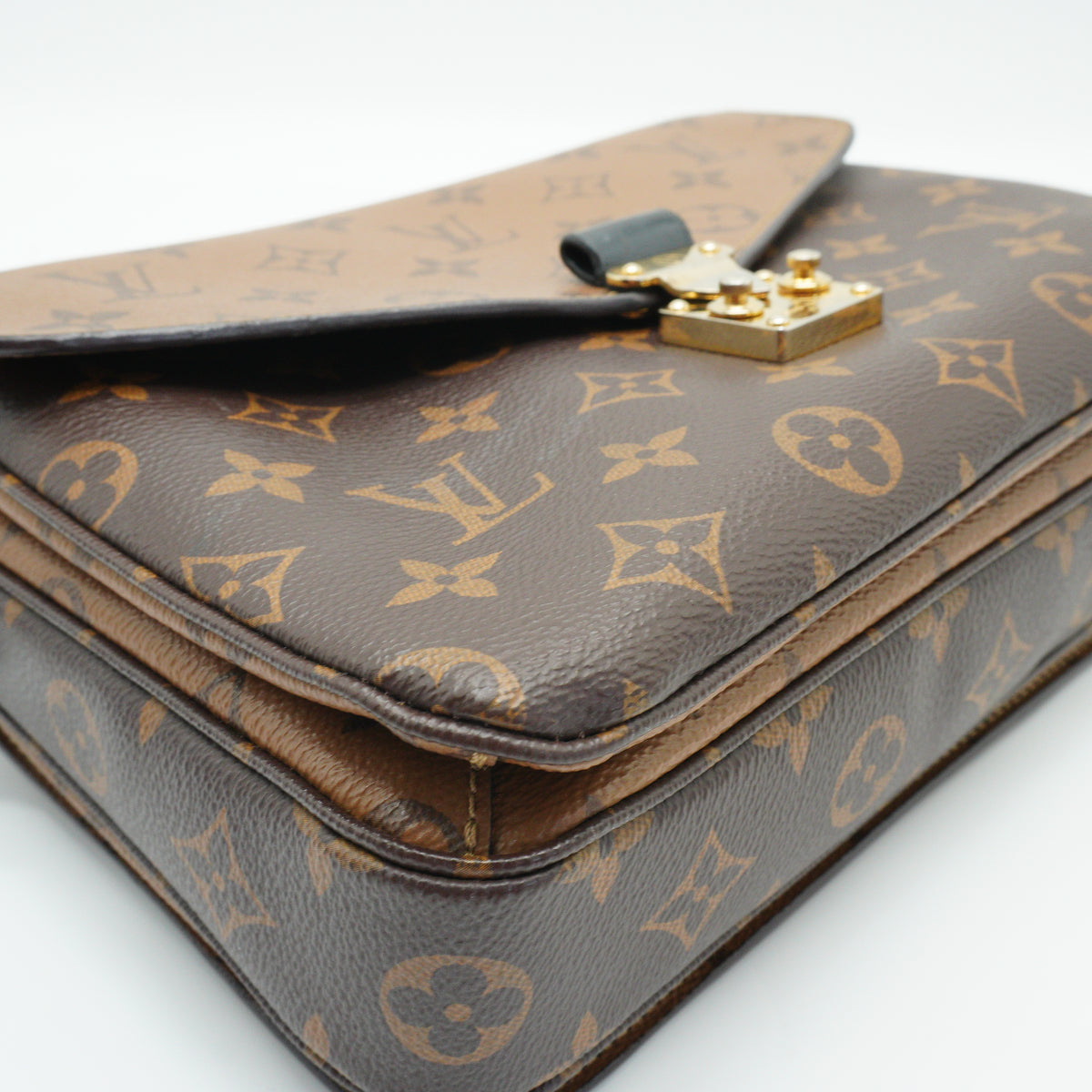 Louis Vuitton	Pochette Métis Mono small GHW