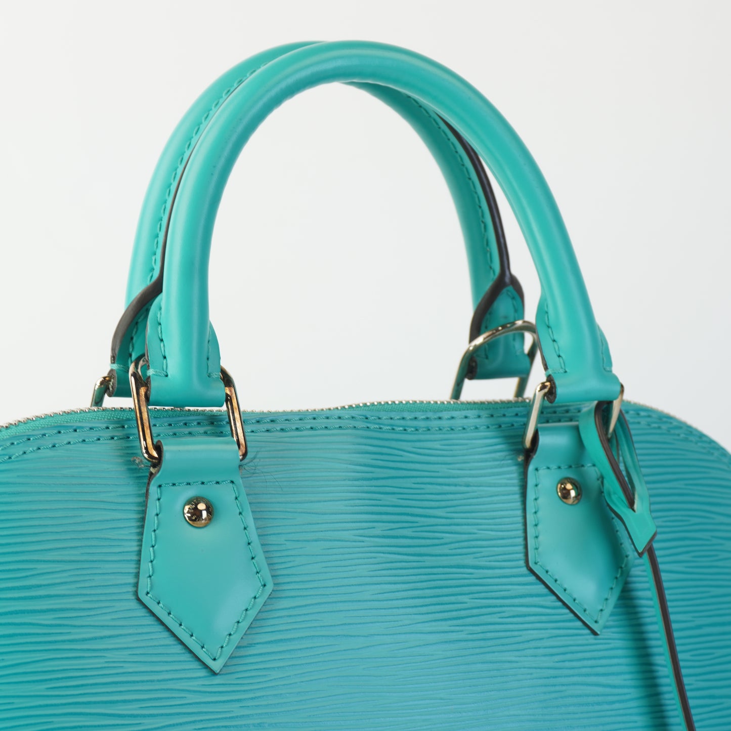 Louis Vuitton	Alma Epi Leather Turquoise