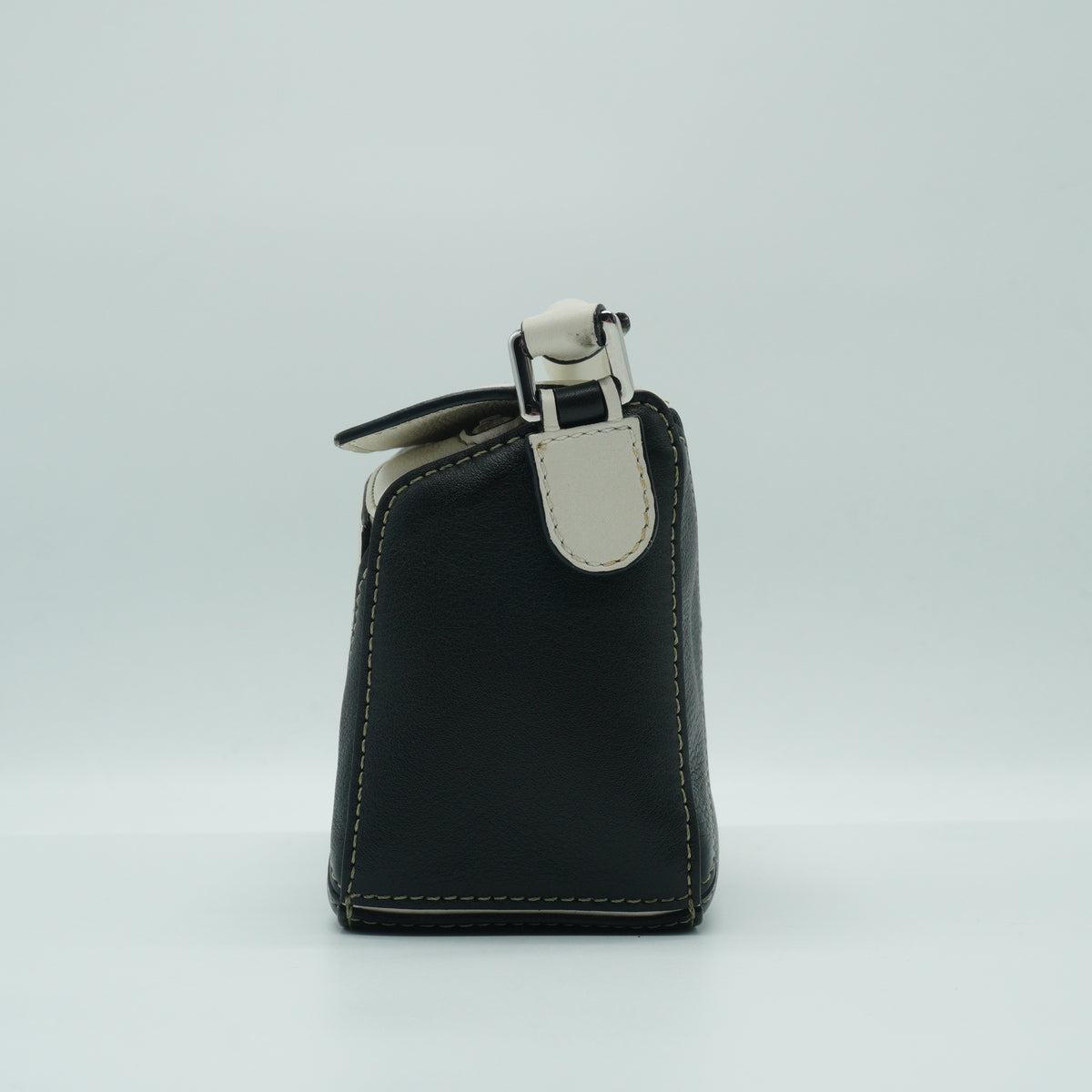 Loewe	Mini Puzzle Bag in a color-blocked soft white rosemary green and black
