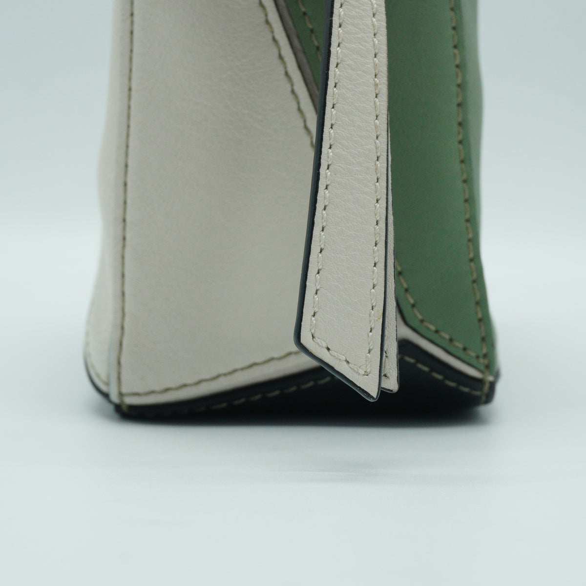 Loewe	Mini Puzzle Bag in a color-blocked soft white rosemary green and black