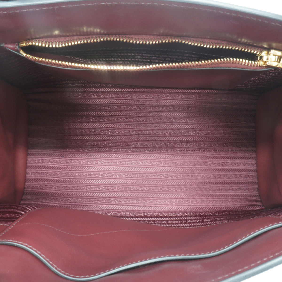 Prada	Saffiano Cuir Monochrome Medium Top Handle Burgundy GHW