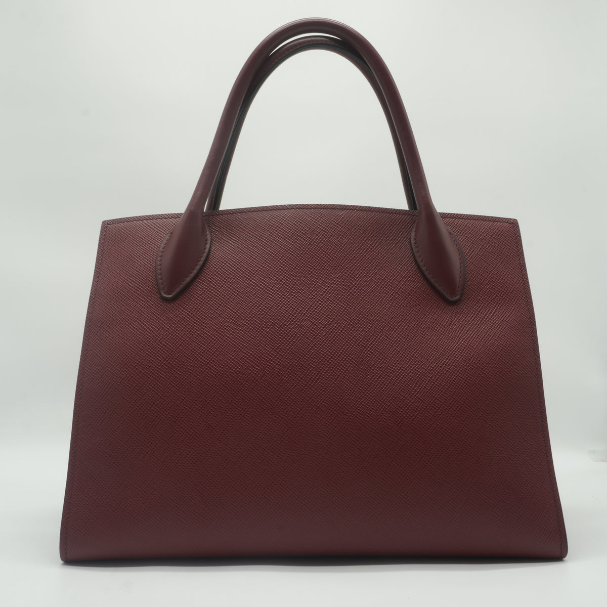 Prada	Saffiano Cuir Monochrome Medium Top Handle Burgundy GHW