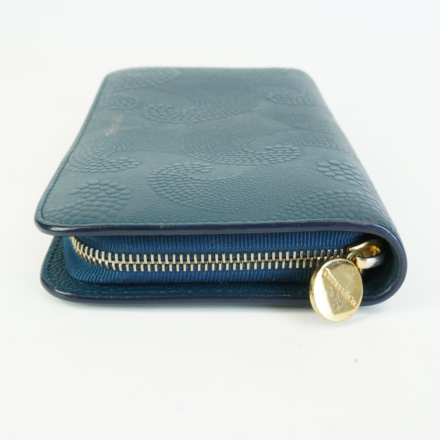 Tiffany & Co.	Wave Embossed Leather Continetal Zip Blue Wallet