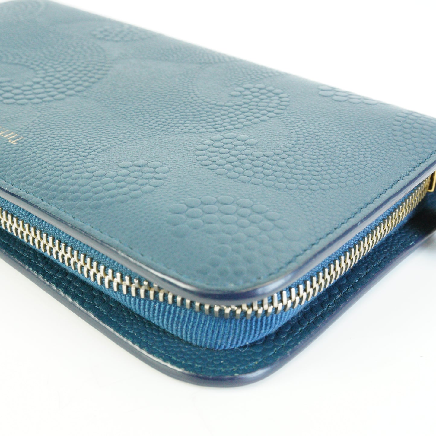 Tiffany & Co.	Wave Embossed Leather Continetal Zip Blue Wallet