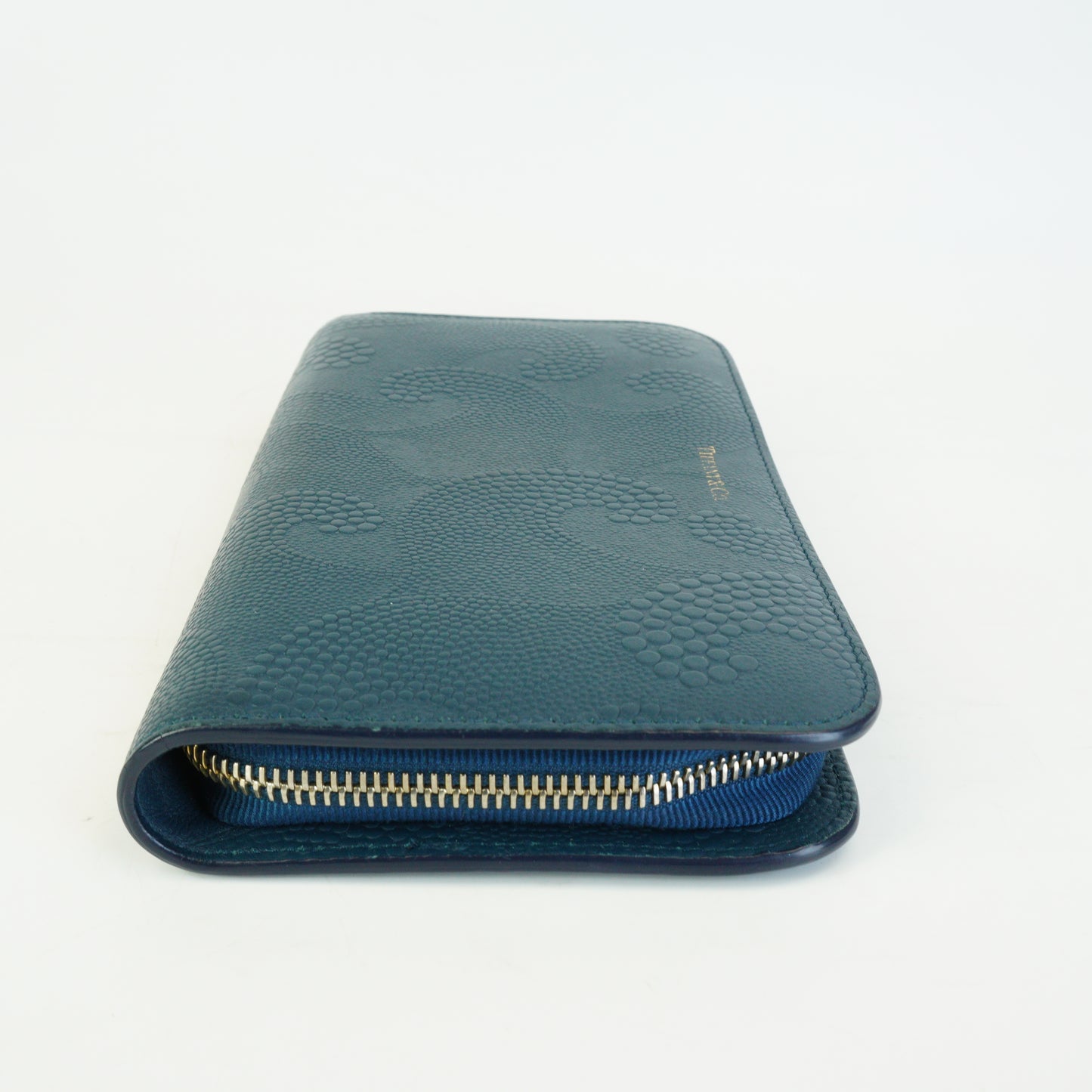 Tiffany & Co.	Wave Embossed Leather Continetal Zip Blue Wallet