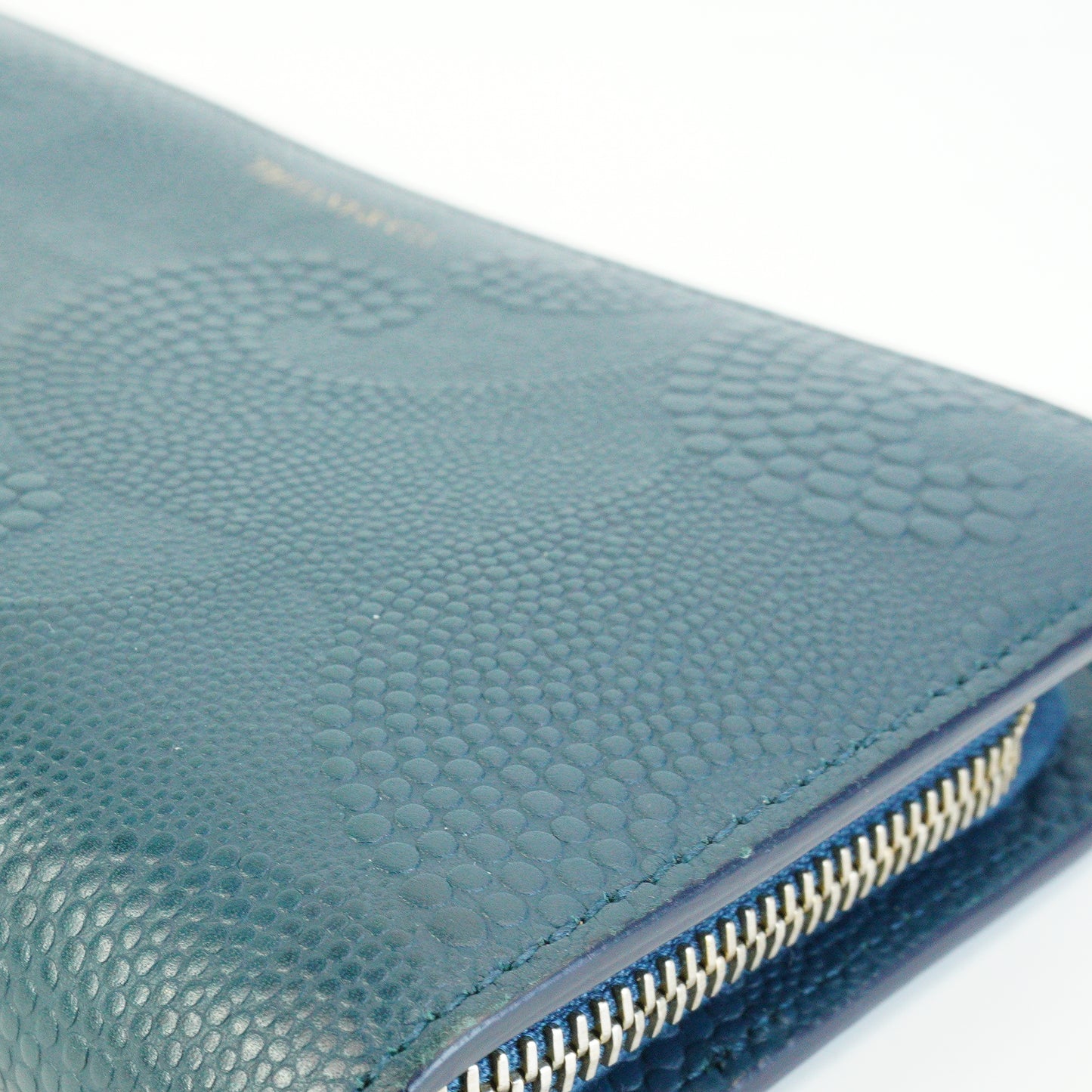 Tiffany & Co.	Wave Embossed Leather Continetal Zip Blue Wallet