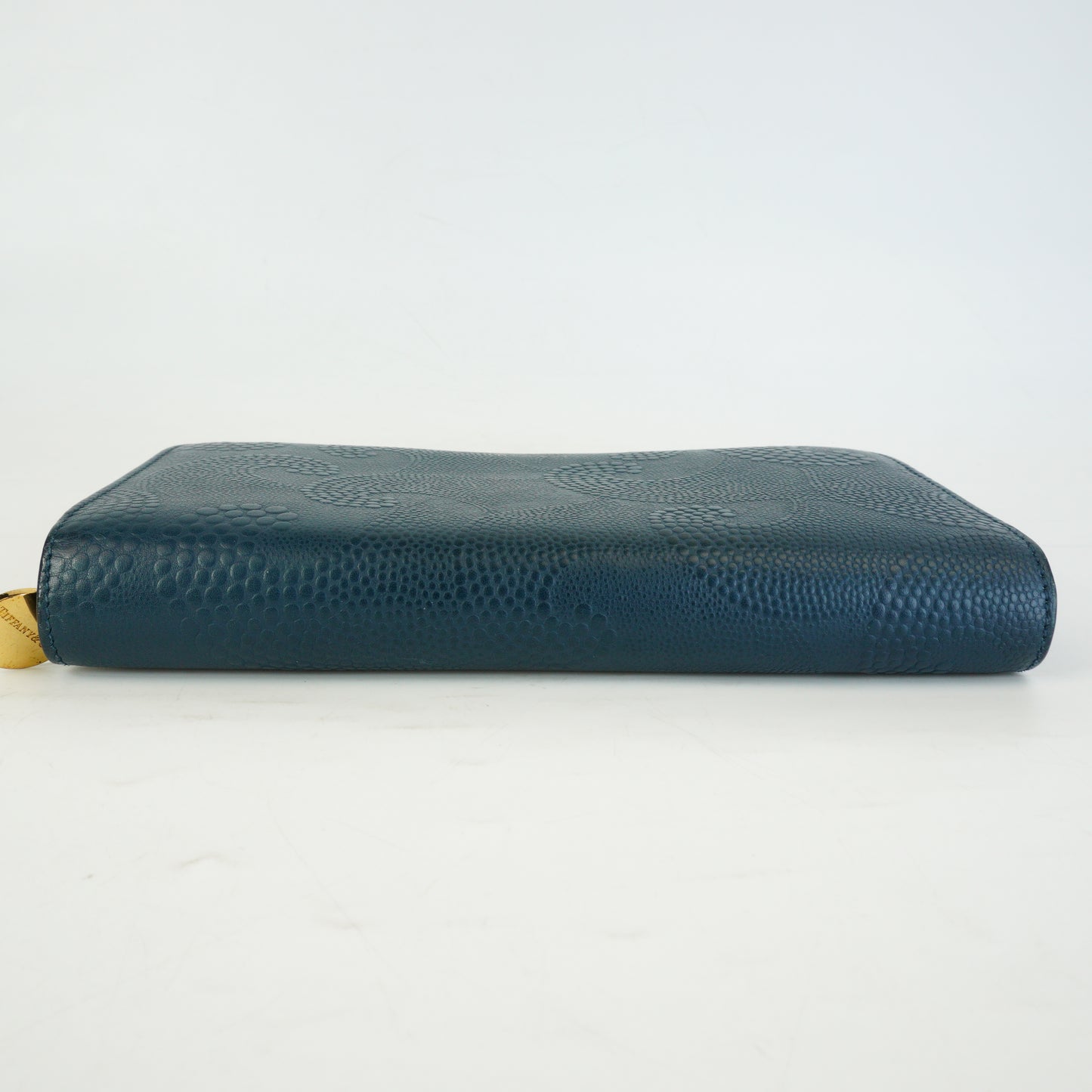 Tiffany & Co.	Wave Embossed Leather Continetal Zip Blue Wallet