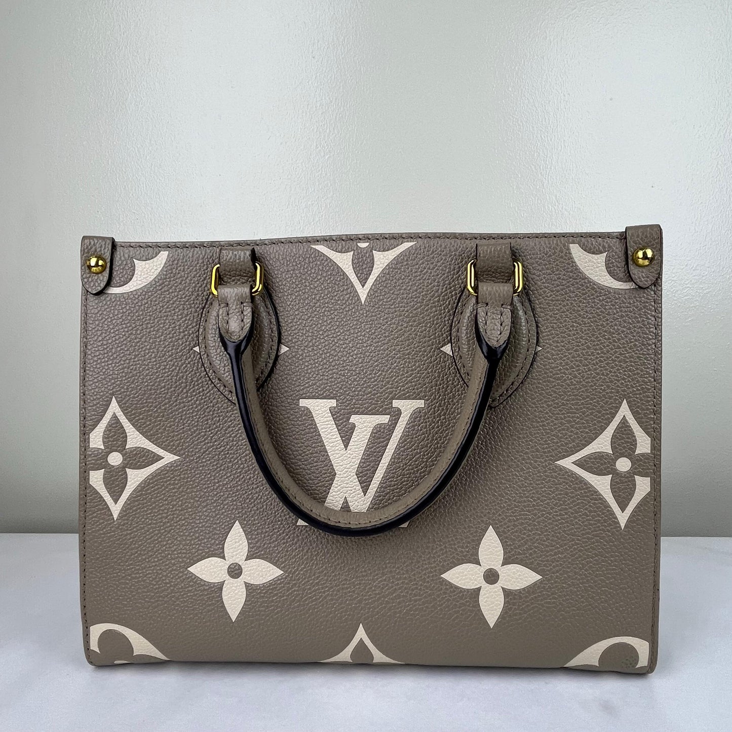Louis Vuitton OnTheGo PM Monogram Empreinte – 6.3"H x 9.8"L x 4.7"W