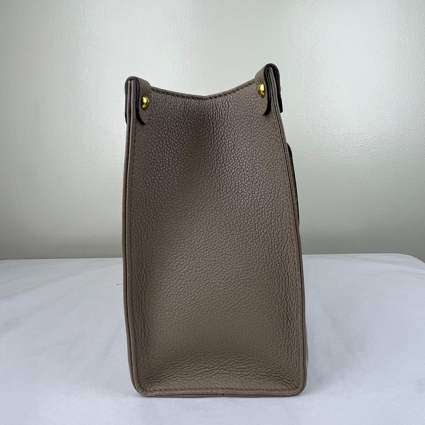 Louis Vuitton OnTheGo PM Monogram Empreinte – 6.3"H x 9.8"L x 4.7"W