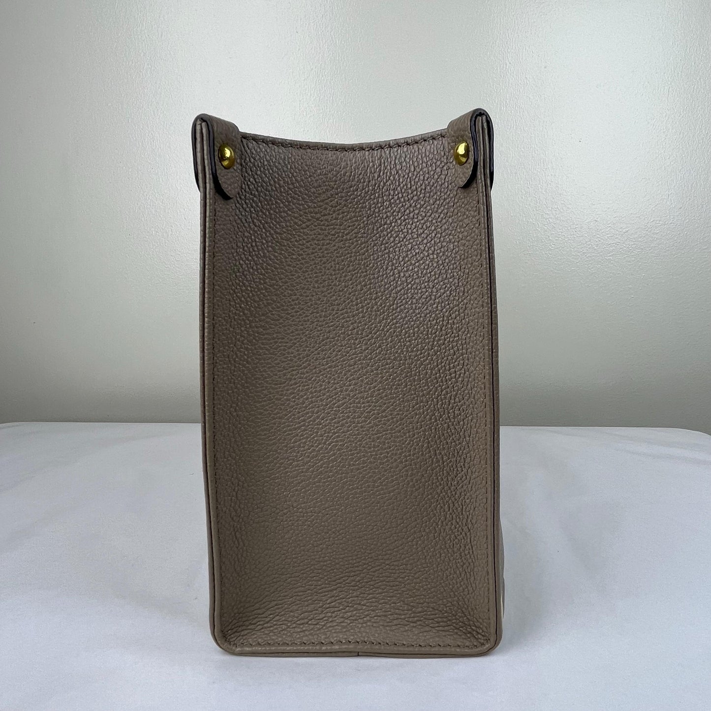Louis Vuitton OnTheGo PM Monogram Empreinte – 6.3"H x 9.8"L x 4.7"W