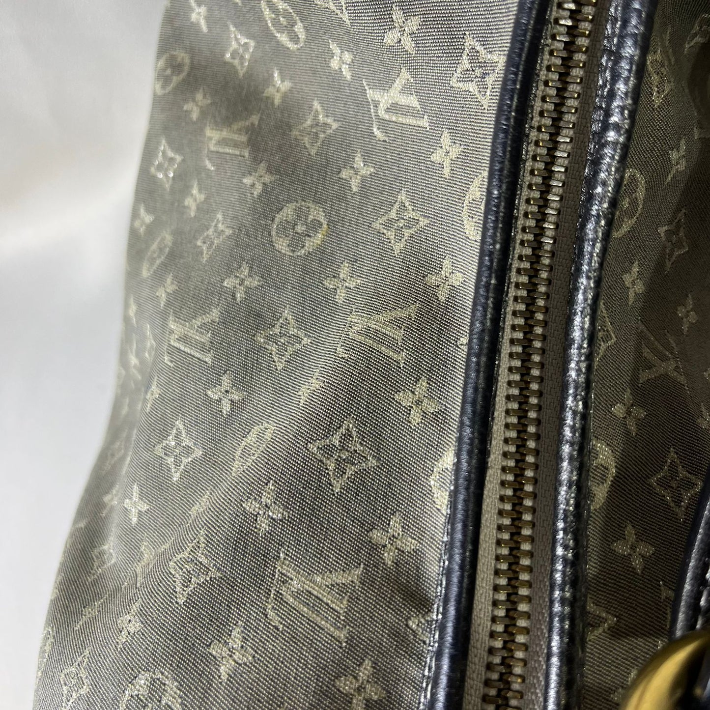 Louis Vuitton	Mini Lin Manon MM Grey Metallic Leather Trim