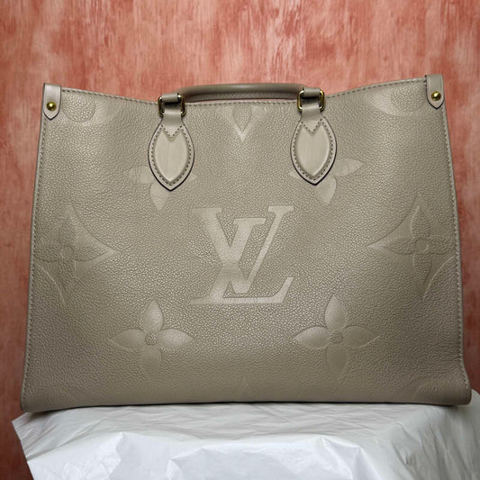 Louis Vuitton	On The Go MM I Monogram Empreinte - 13.78"L x 10.63"H x 5.51"W