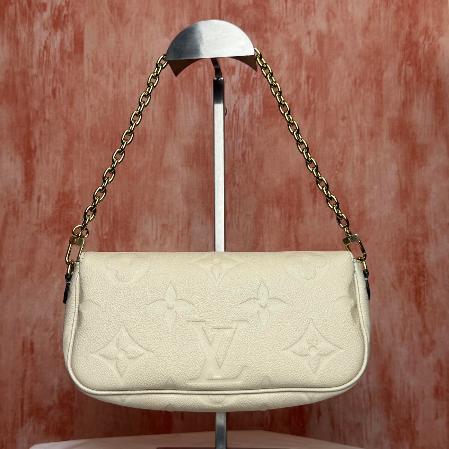 Louis Vuitton	Monogram Empreinte - Ivy White 9.25"L x 4.72"H x 1.69"W