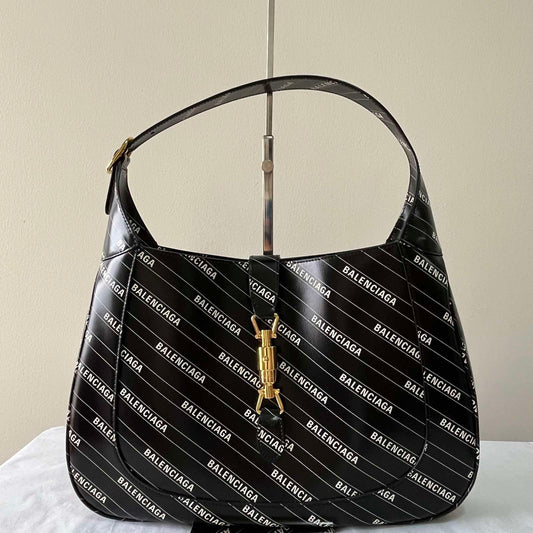 Gucci x Balenciaga Hacker Jackie – 7.5"H x 10.6"L x 1.6"W