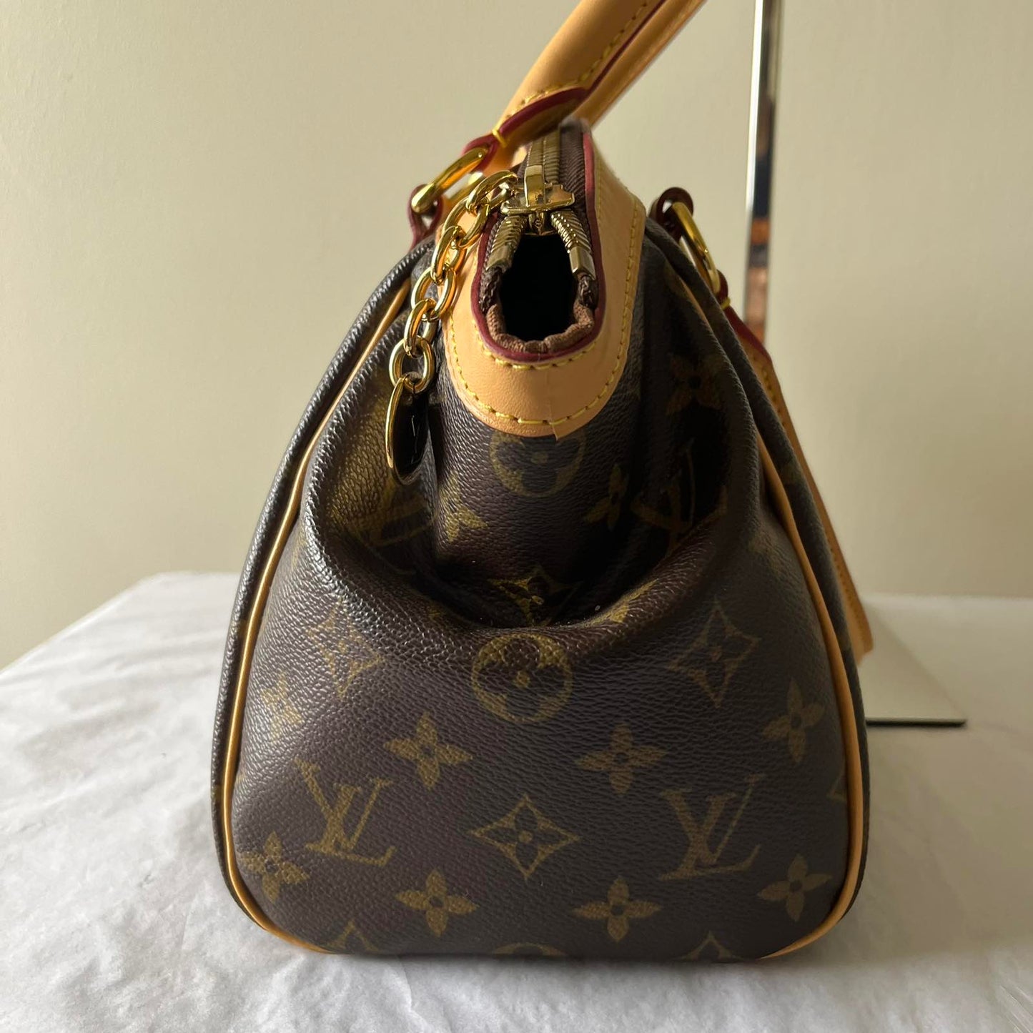 Louis Vuitton Tivoli PM Monogram Canvas – 8.3"H x 11.8"L x 5.5"W