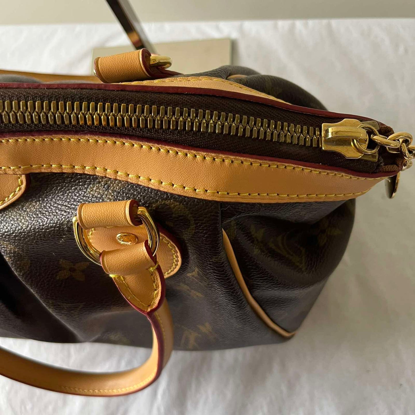 Louis Vuitton Tivoli PM Monogram Canvas – 8.3"H x 11.8"L x 5.5"W